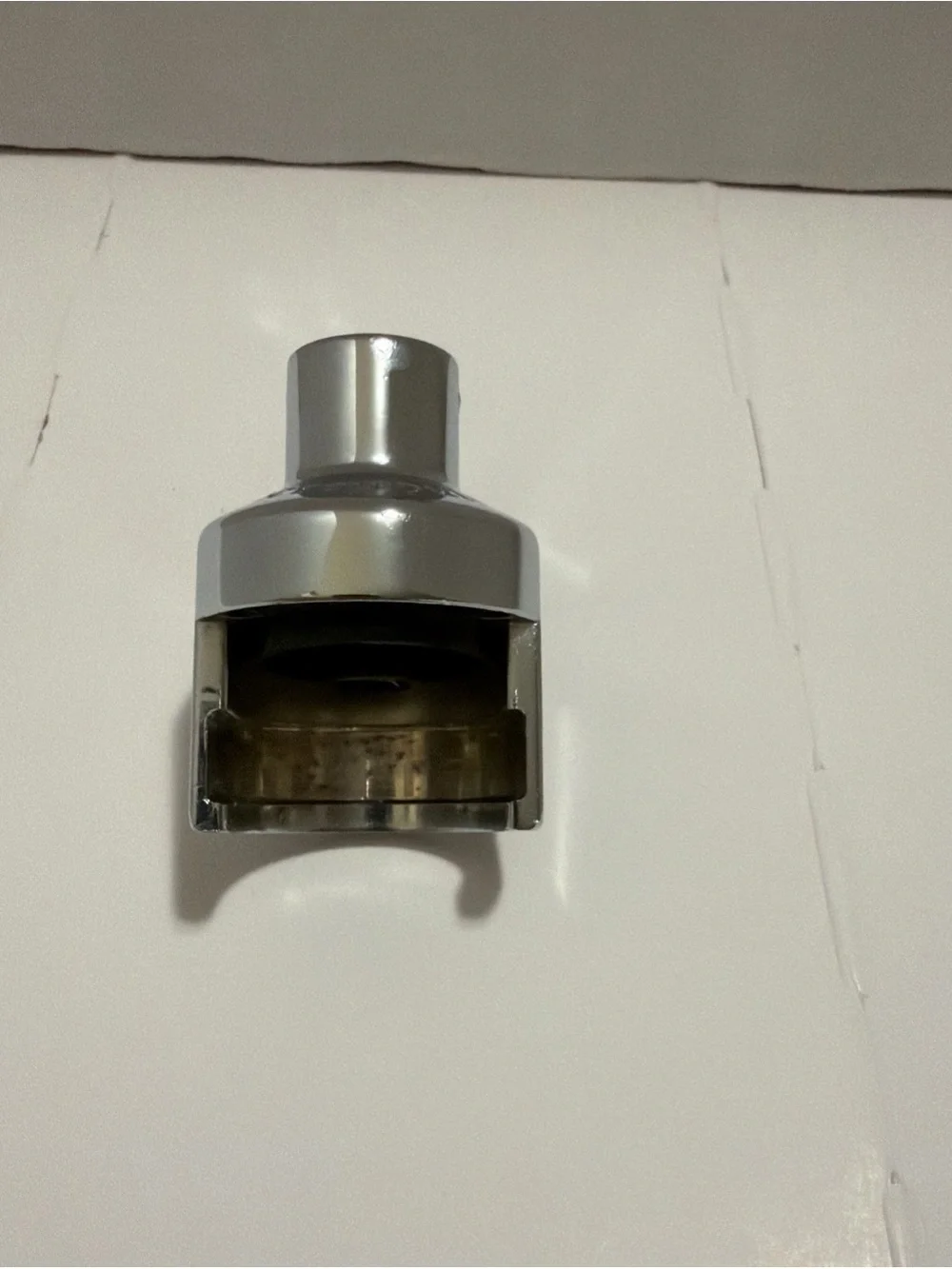 Le Creuset Champagne Crown Sealer, specifically a satin chrome.